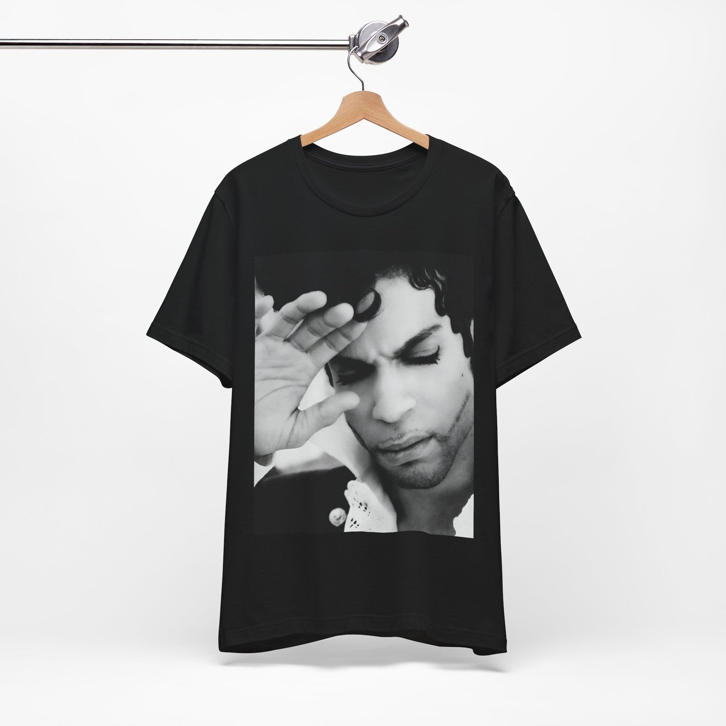 A black graphic t-shirt featuring a black and white graphic or photo portrait of Prince.