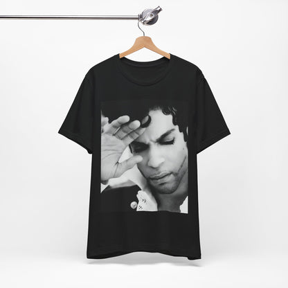 A black graphic t-shirt featuring a black and white graphic or photo portrait of Prince.