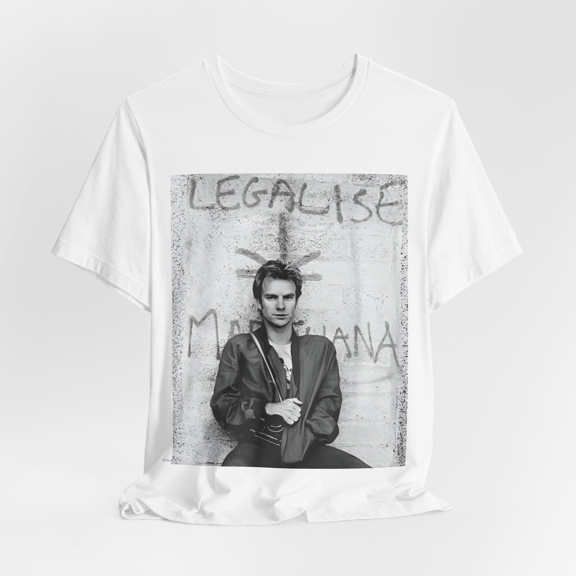 A black graphic t-shirt featuring a graphic of The Police with reggae-influenced pop elements.