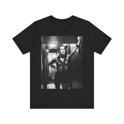 A black graphic t-shirt featuring a graphic of Maneskin emphasizing a rebel rock spirit.