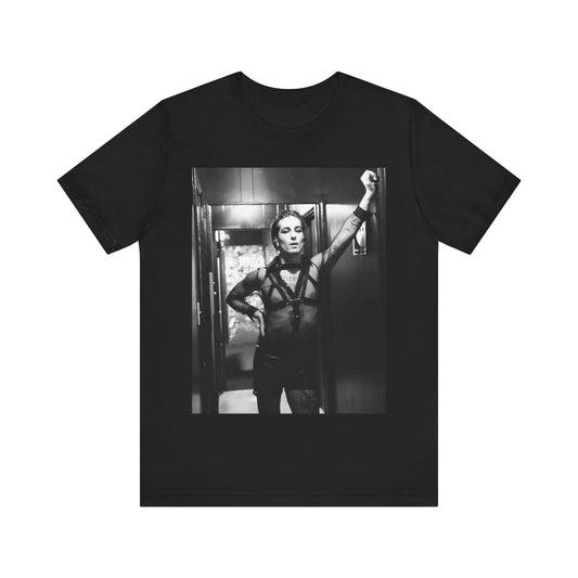 A black graphic t-shirt featuring a graphic of Maneskin emphasizing a rebel rock spirit.