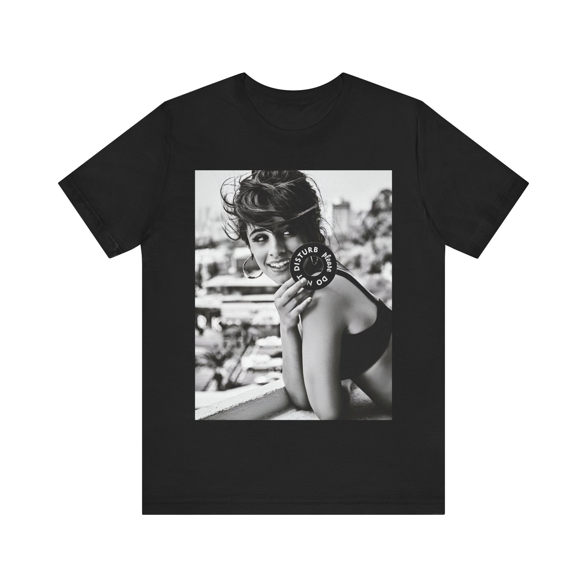 A black graphic t-shirt featuring a black and white photo or graphic of Camila Cabello in an iconic style.