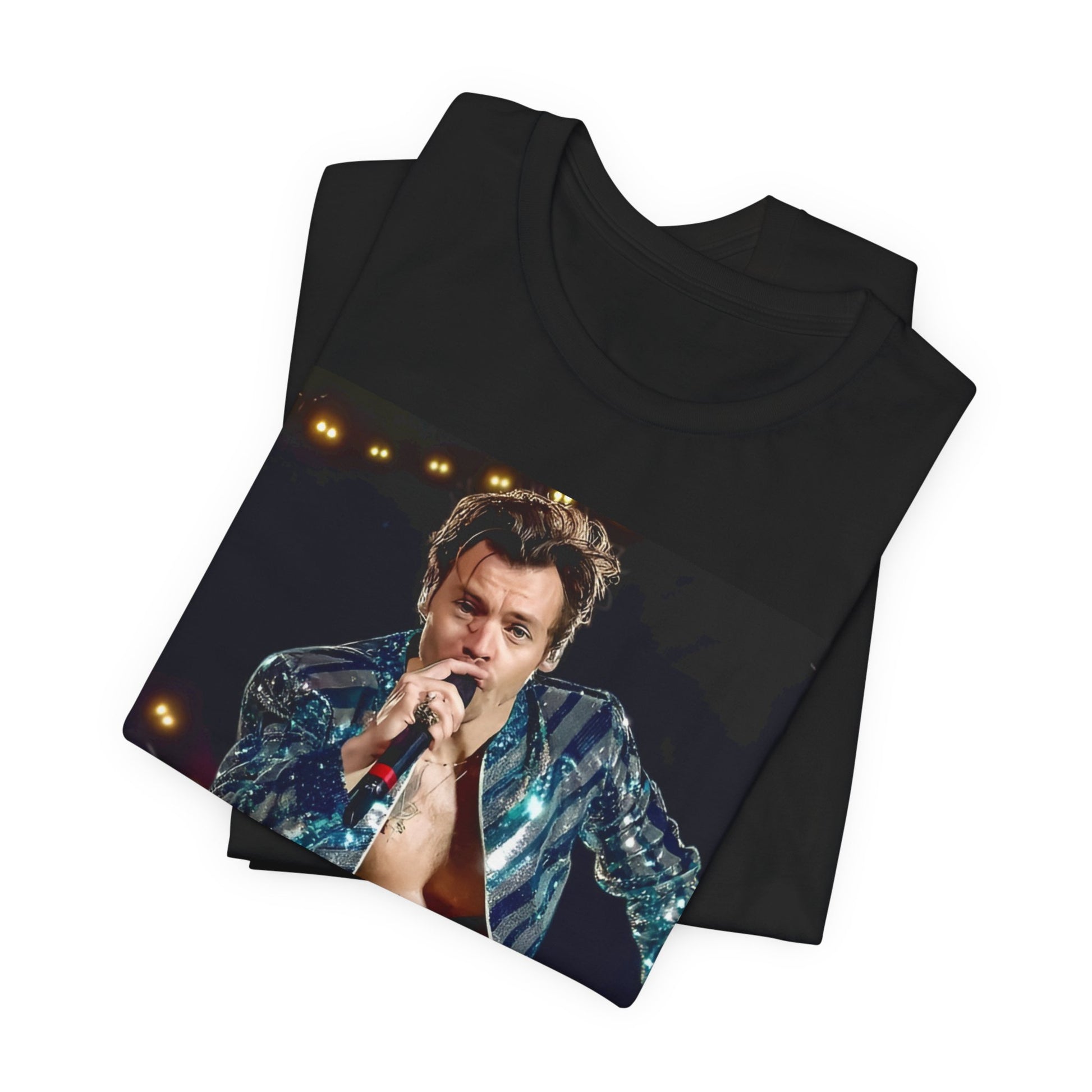A black graphic t-shirt featuring a graphic related to Harry Styles' 'Adore You' song or era.