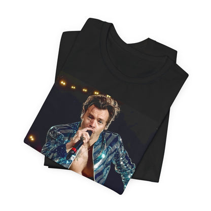 A black graphic t-shirt featuring a graphic related to Harry Styles' 'Adore You' song or era.