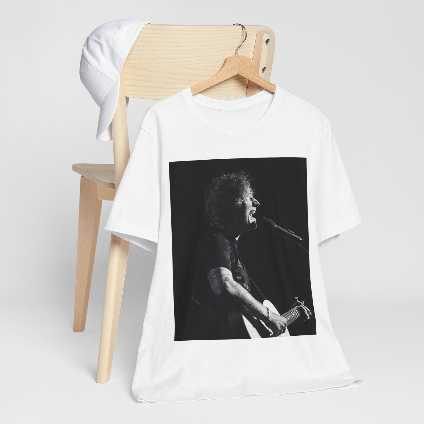 A black graphic t-shirt featuring a graphic related to Ed Sheeran's stadium tour.