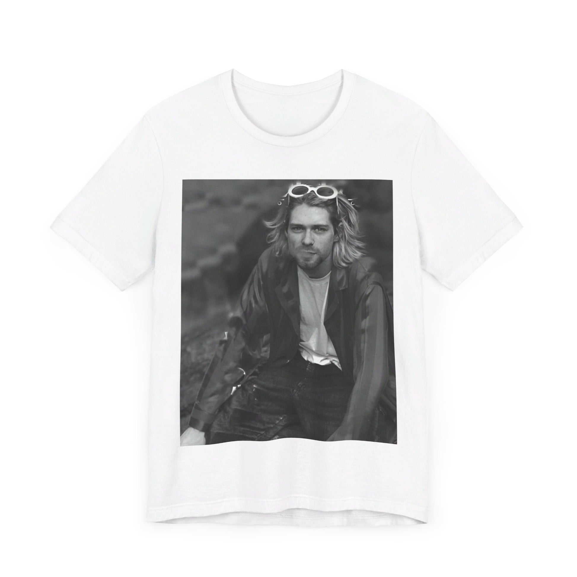 A black graphic t-shirt featuring a 90s black and white photo portrait of Kurt Cobain from Nirvana.