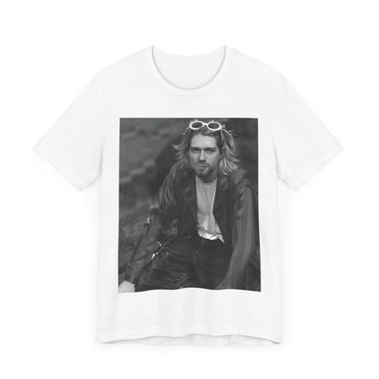 A black graphic t-shirt featuring a 90s black and white photo portrait of Kurt Cobain from Nirvana.