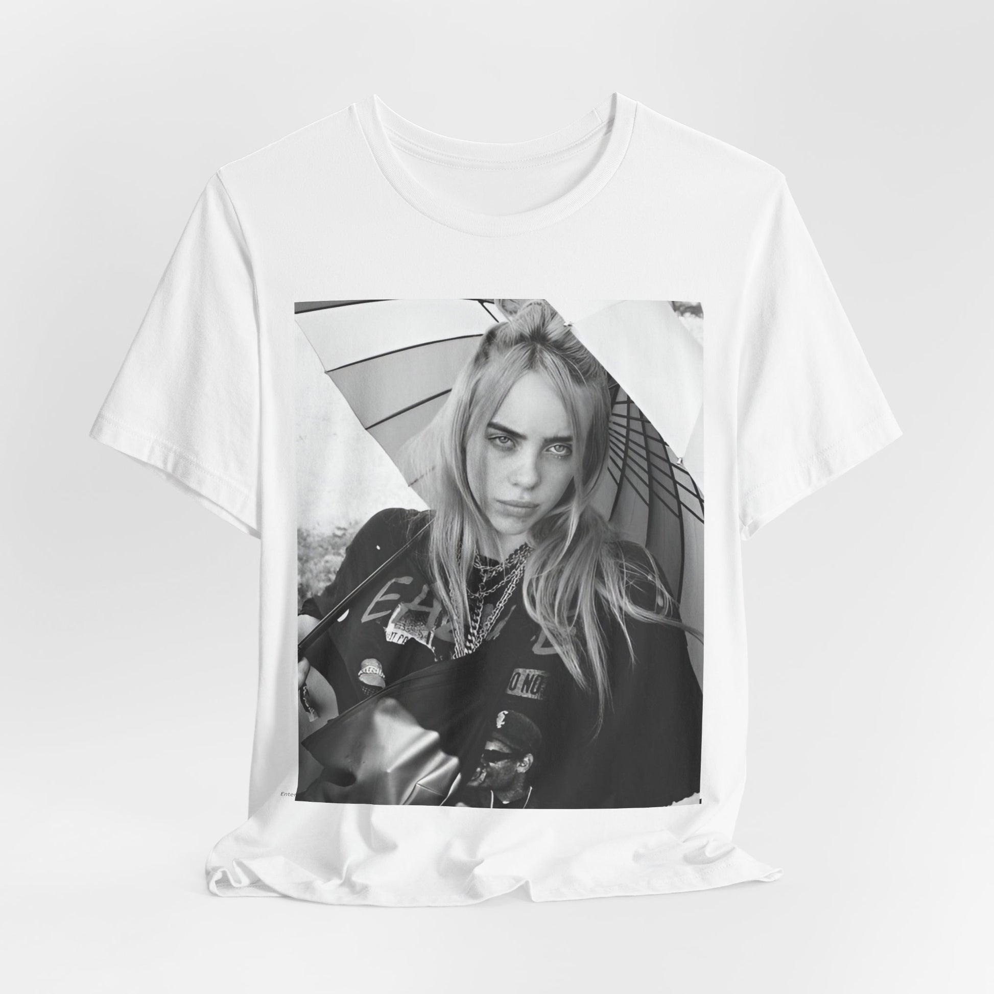 A graphic t-shirt inspired by the colorful and iconic music video for "Bad Guy" by Billie Eilish.
