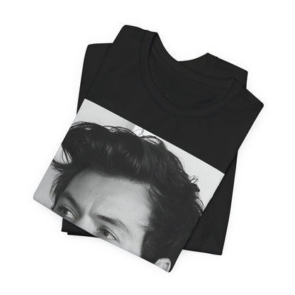 A black graphic t-shirt featuring a black and white, monochrome graphic or photo of Harry Styles.