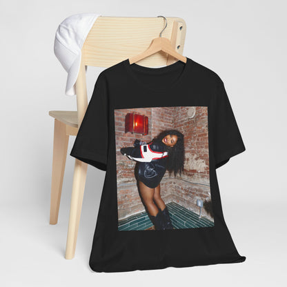 A black graphic t-shirt featuring a graphic of SZA as a TDE Queen R&B icon.