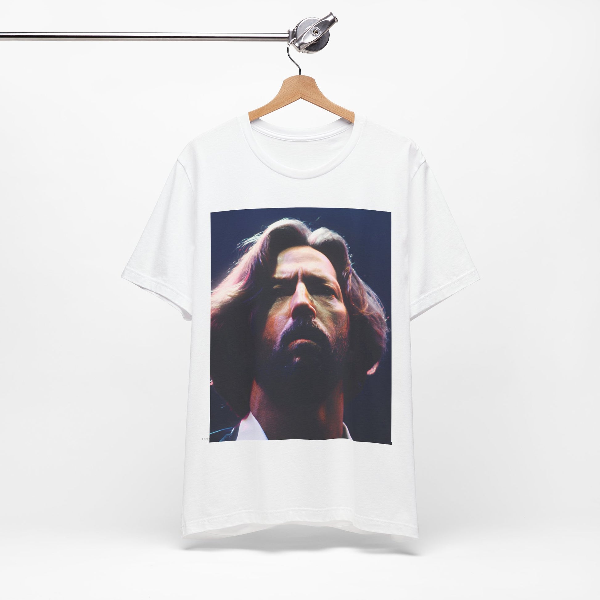 A black graphic t-shirt featuring a graphic related to Eric Clapton's 'Tears in Heaven' song or era.
