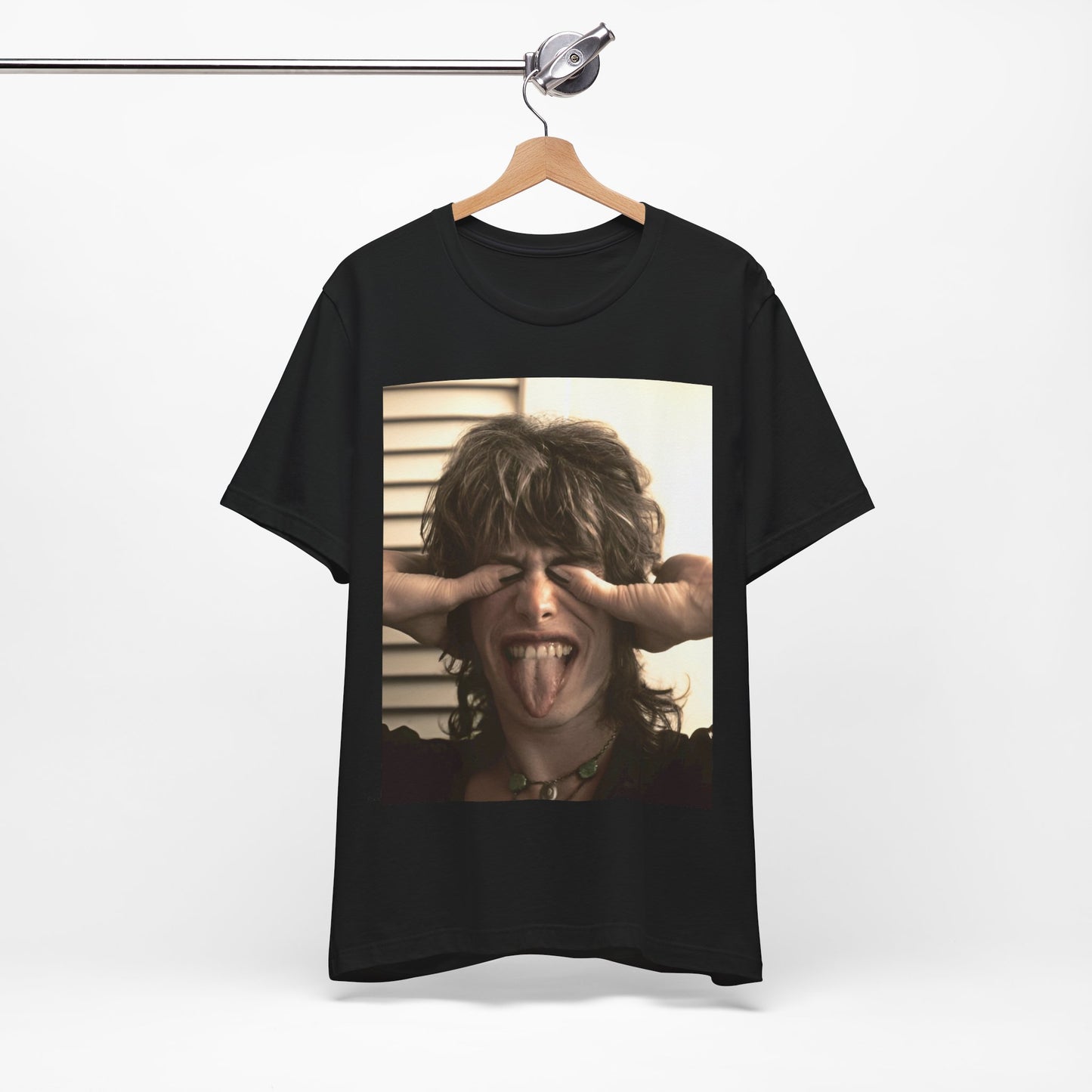 A black graphic t-shirt featuring a vintage 70s band photo of Aerosmith, showing the members in their iconic early looks.