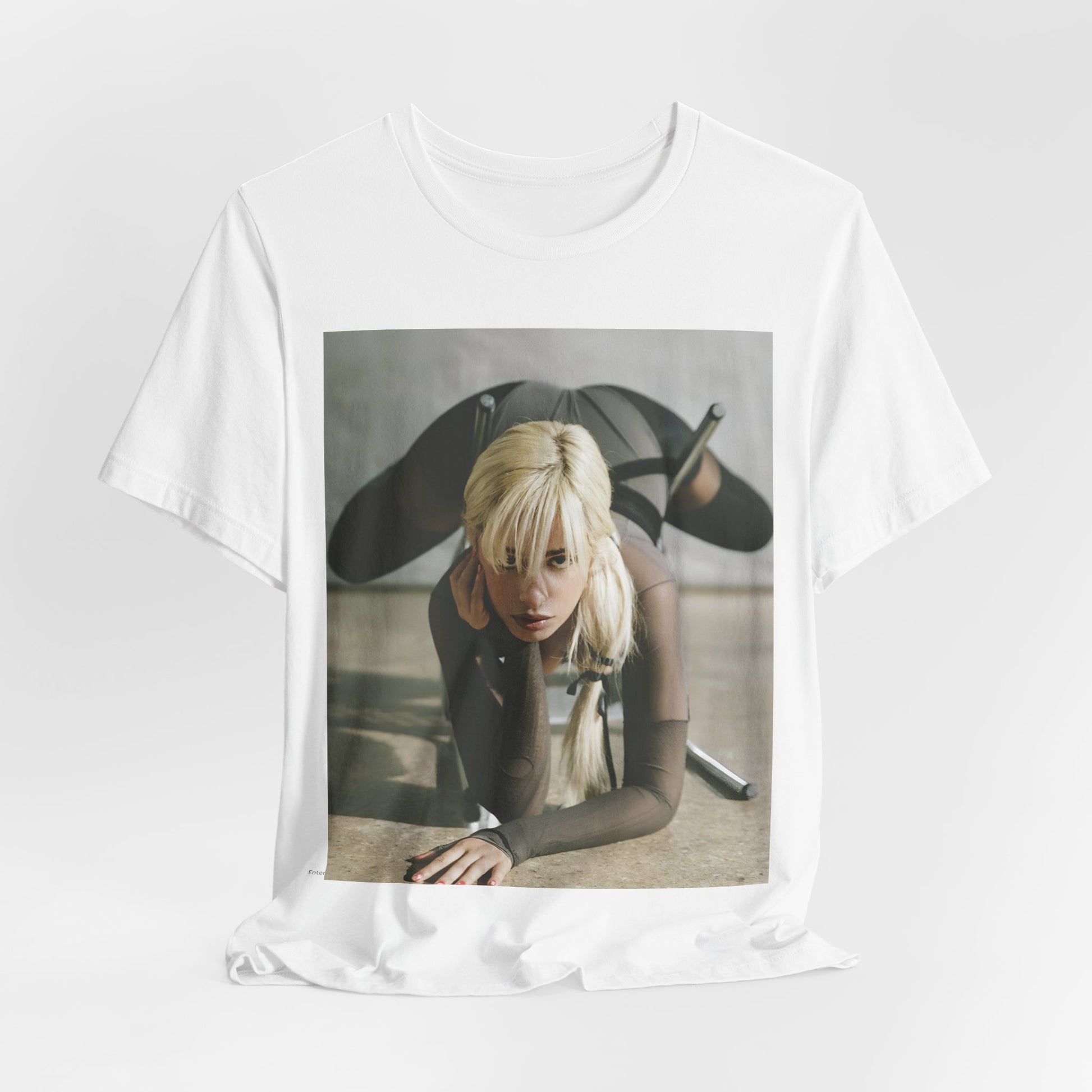 A black graphic t-shirt featuring a vintage-style graphic of Camila Cabello, possibly with a crown or 'Pop Queen' title.