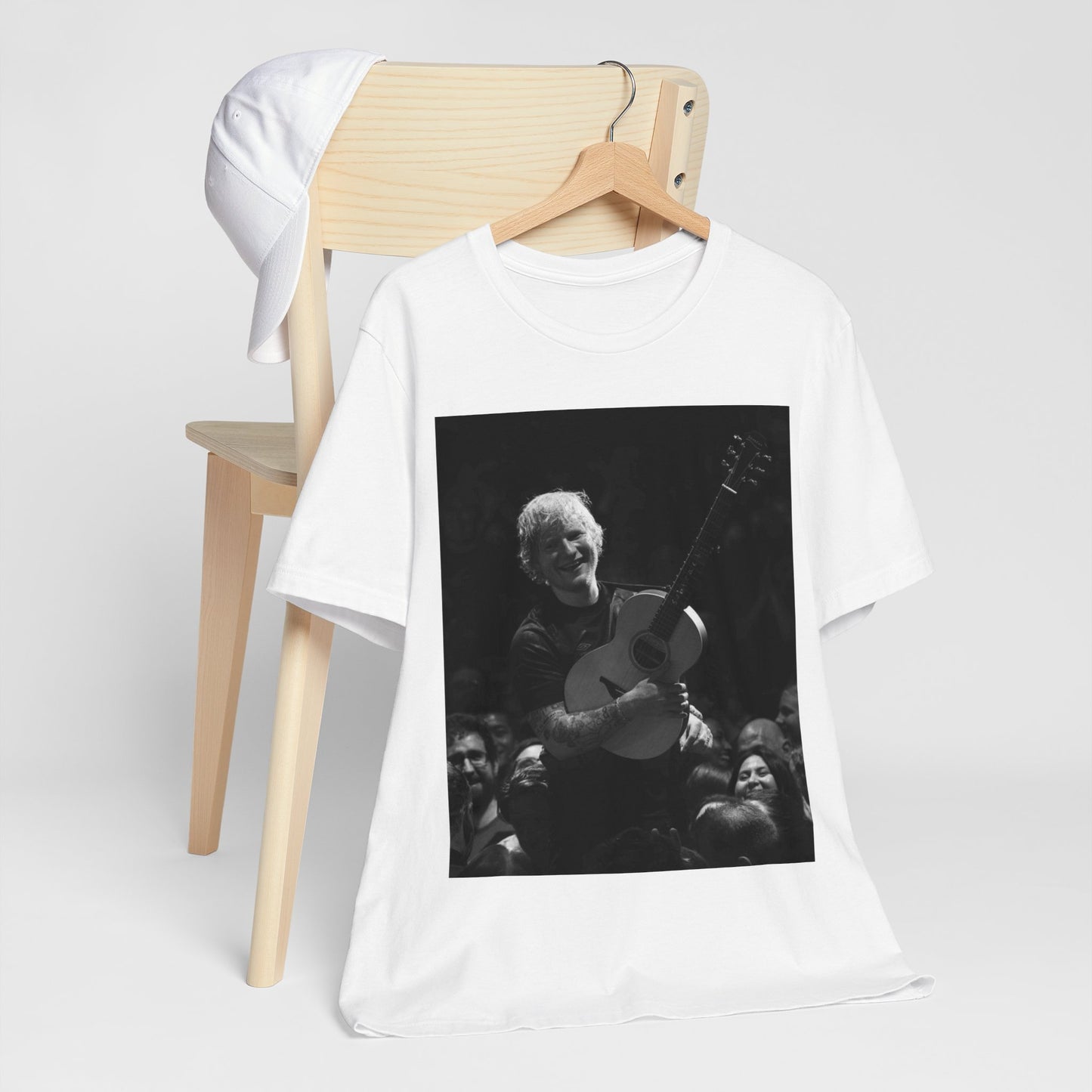 A black graphic t-shirt featuring a photo of Ed Sheeran performing live with his guitar.