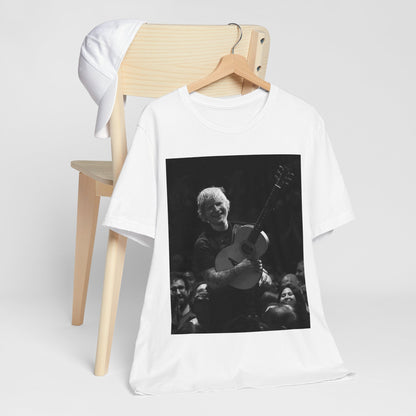 A black graphic t-shirt featuring a photo of Ed Sheeran performing live with his guitar.
