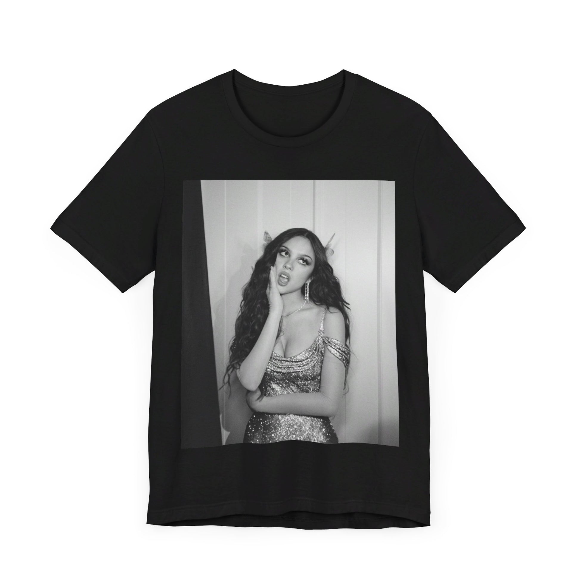A black graphic t-shirt featuring a black and white, monochrome graphic or photo of Olivia Rodrigo.