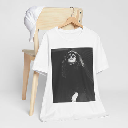 A black graphic t-shirt featuring a black and white, monochrome graphic or photo of Selena Gomez.