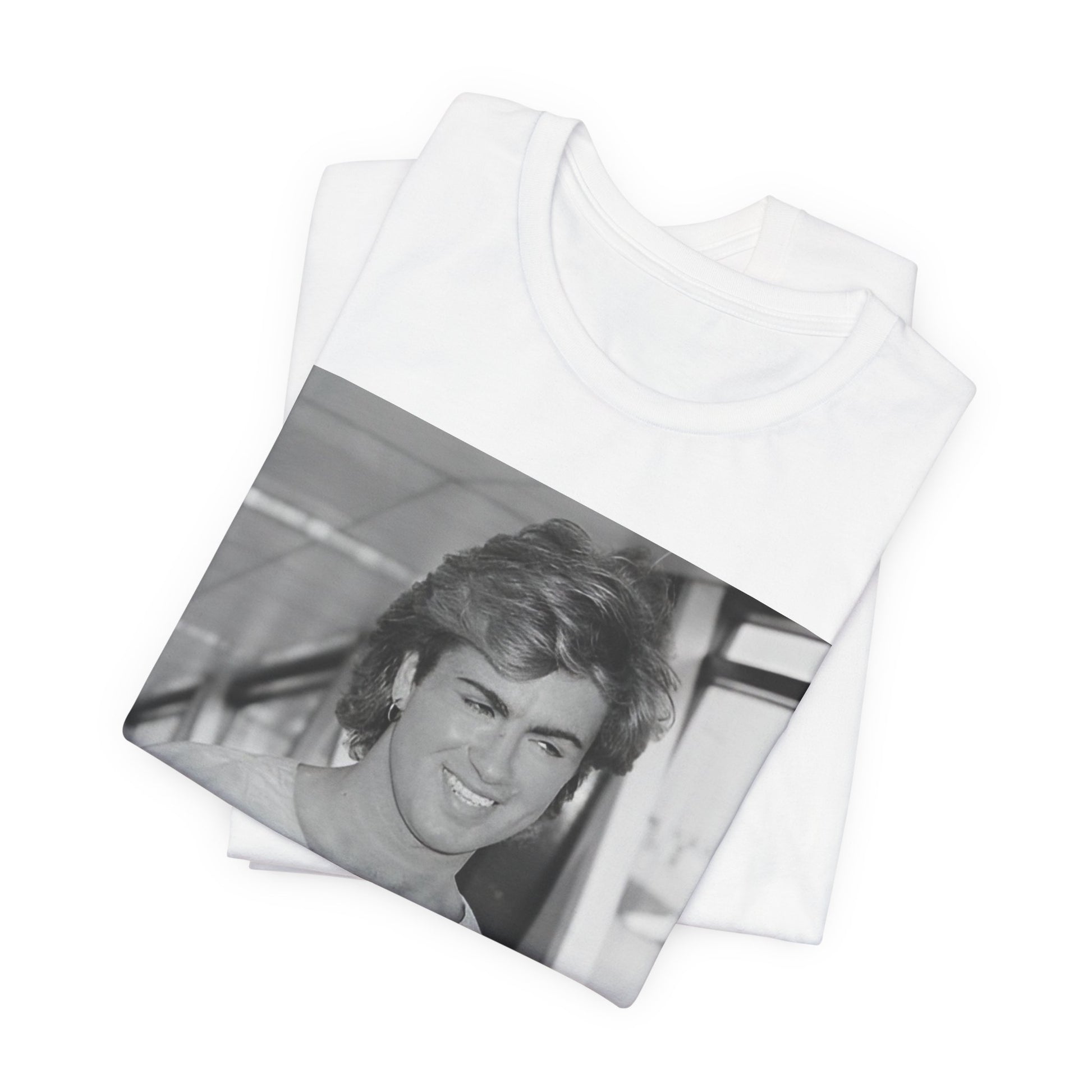 A black graphic t-shirt featuring an 80s black and white vintage photo or graphic of George Michael.