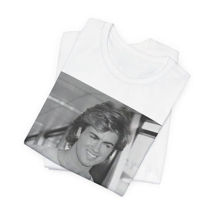 A black graphic t-shirt featuring an 80s black and white vintage photo or graphic of George Michael.