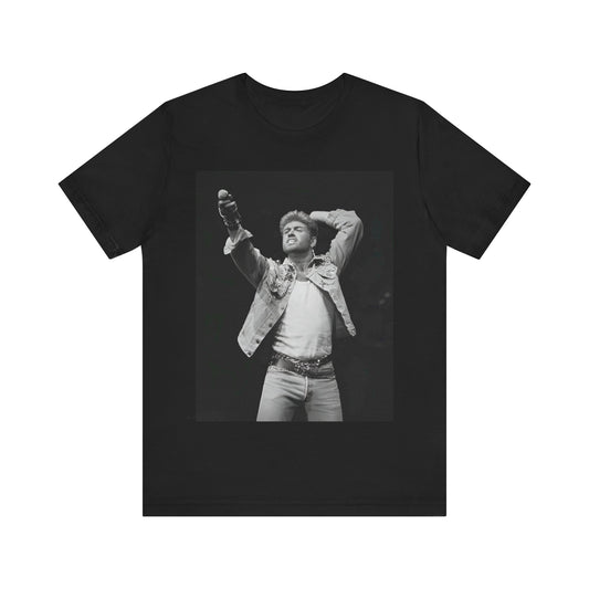 A black graphic t-shirt featuring a graphic or photo of George Michael performing live on stage.