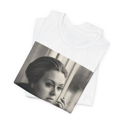 A black graphic t-shirt featuring a black and white photo of Adele, showing her with a serene or thoughtful expression.