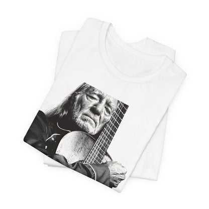 A black graphic t-shirt featuring a vintage country legend graphic of Willie Nelson.
