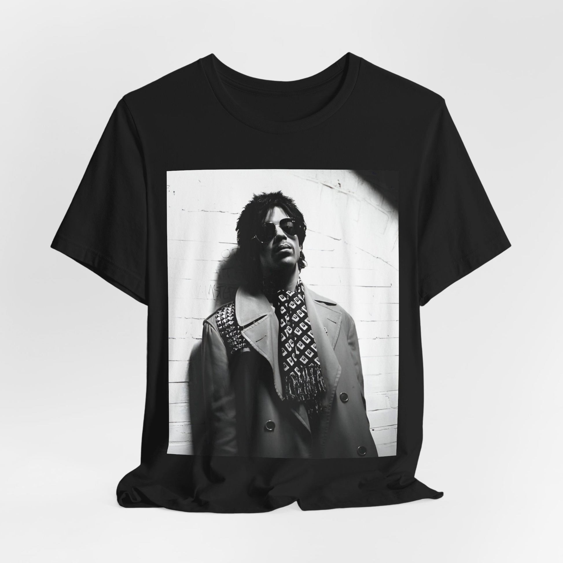 A black graphic t-shirt featuring Prince's iconic symbol, representing 'The Artist Formerly Known As'.