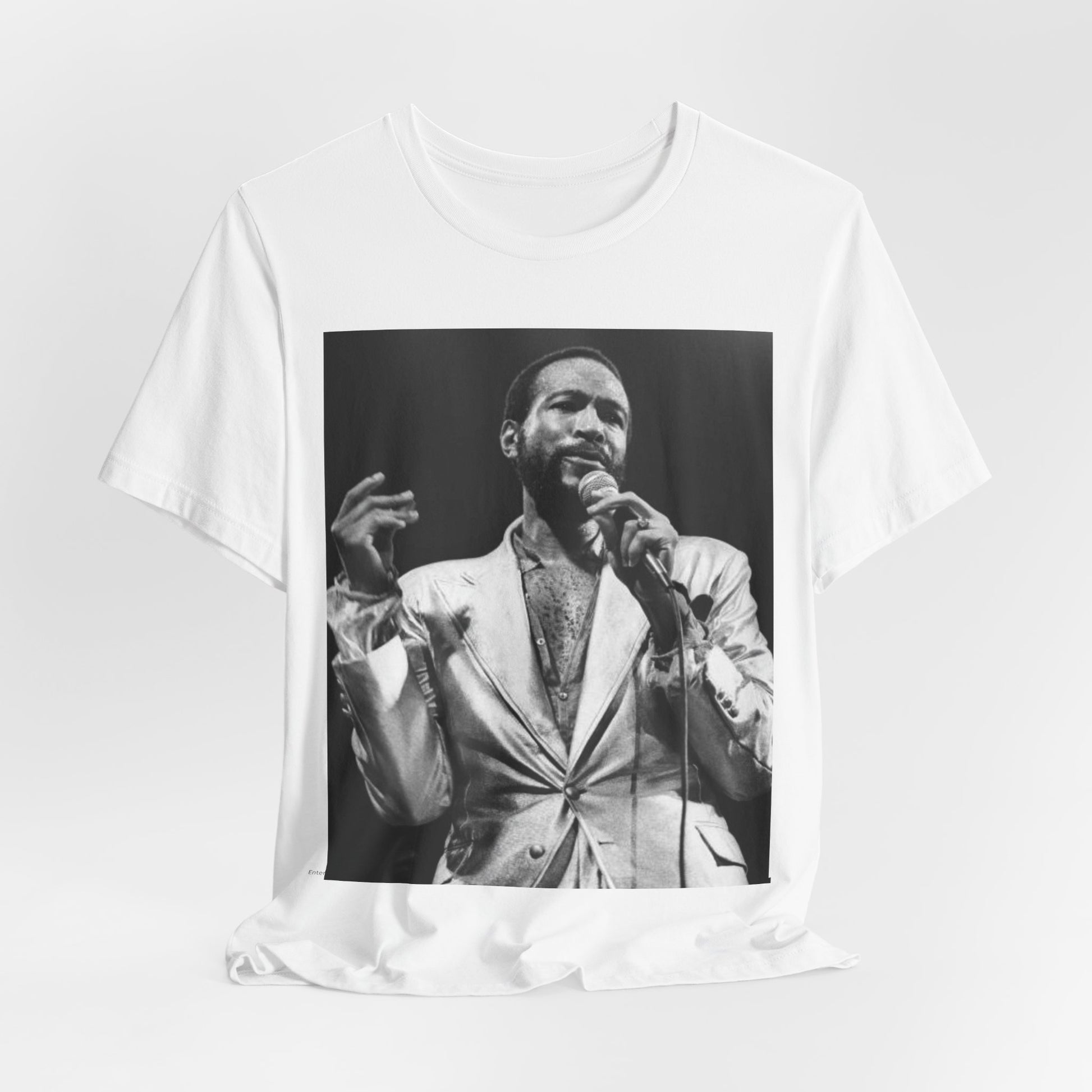 A black graphic t-shirt featuring a retro black and white photo or graphic of Marvin Gaye performing live on stage.