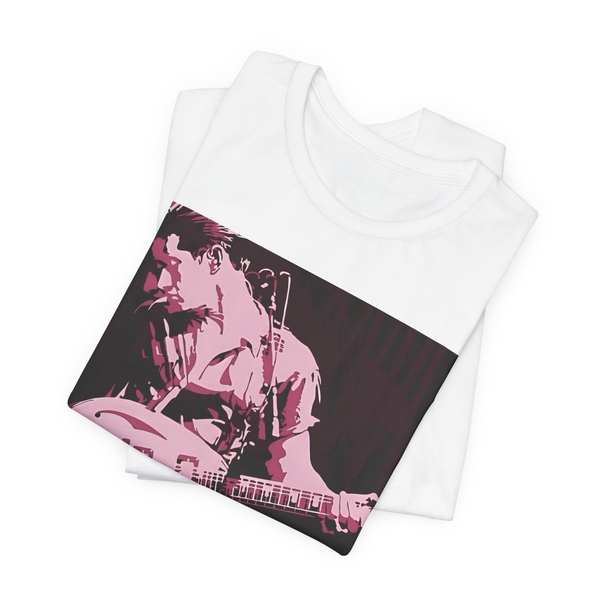 A black graphic t-shirt featuring the Arctic Monkeys logo in a prominent pink color, creating an aesthetic look.
