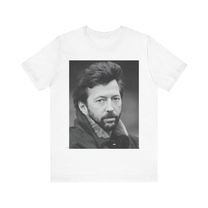 A black graphic t-shirt featuring a 70s rock aesthetic graphic of Eric Clapton.