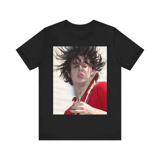 A black graphic t-shirt featuring a retro graphic of Jack White from The White Stripes playing guitar.