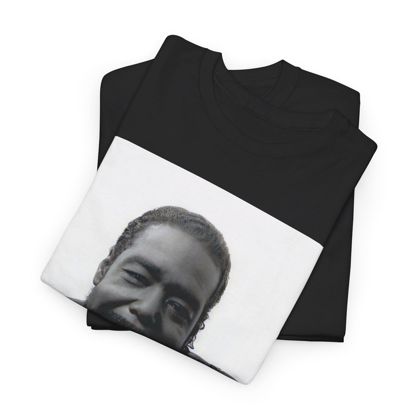 A black graphic t-shirt featuring a black and white photo of Barry White with his iconic smile.