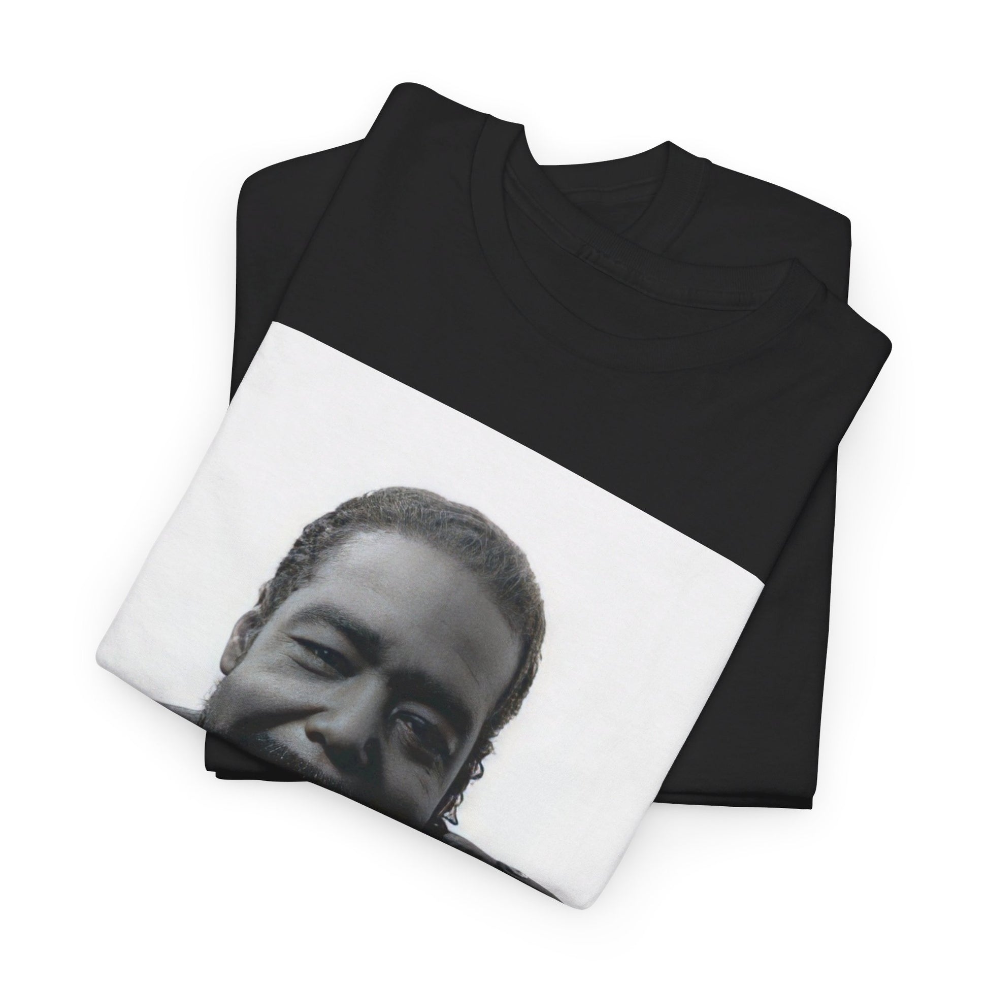 A black graphic t-shirt featuring a black and white photo of Barry White with his iconic smile.