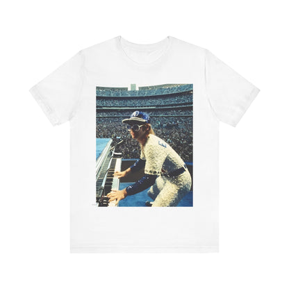 A black graphic t-shirt featuring a photo of Elton John from his 1975 Dodgers Stadium concert.