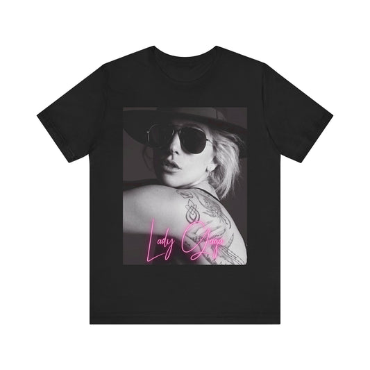 A black graphic t-shirt featuring a fierce graphic related to Lady Gaga's 'Bad Romance' song or era.