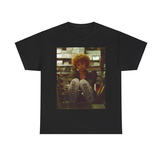 A black graphic t-shirt featuring a stylized graphic of Ice Spice as a TikTok Queen or global sensation.