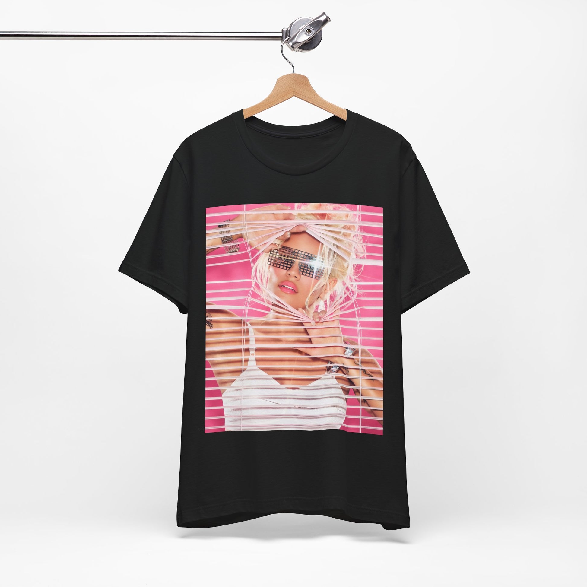 A black graphic t-shirt featuring a graphic of Karol G in a cool Latin trap style.