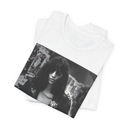 A black graphic t-shirt featuring a 70s black and white photo portrait of Joey Ramone from Ramones.
