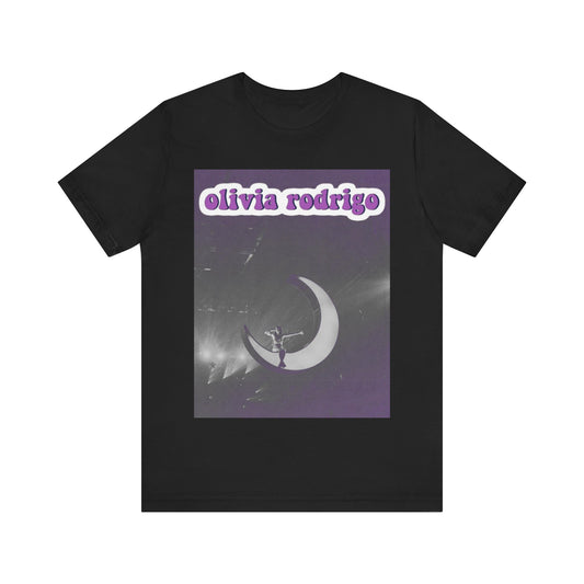 A black graphic t-shirt featuring a graphic or photo of Olivia Rodrigo performing live on stage.