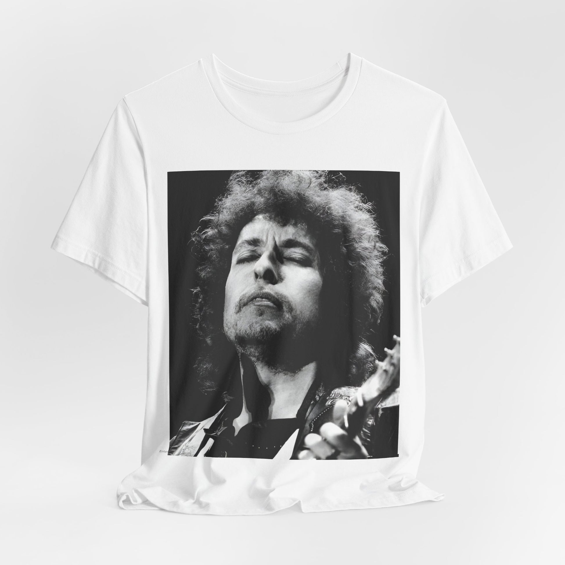 A black graphic t-shirt featuring a retro black and white graphic or photo of Bob Dylan performing live.