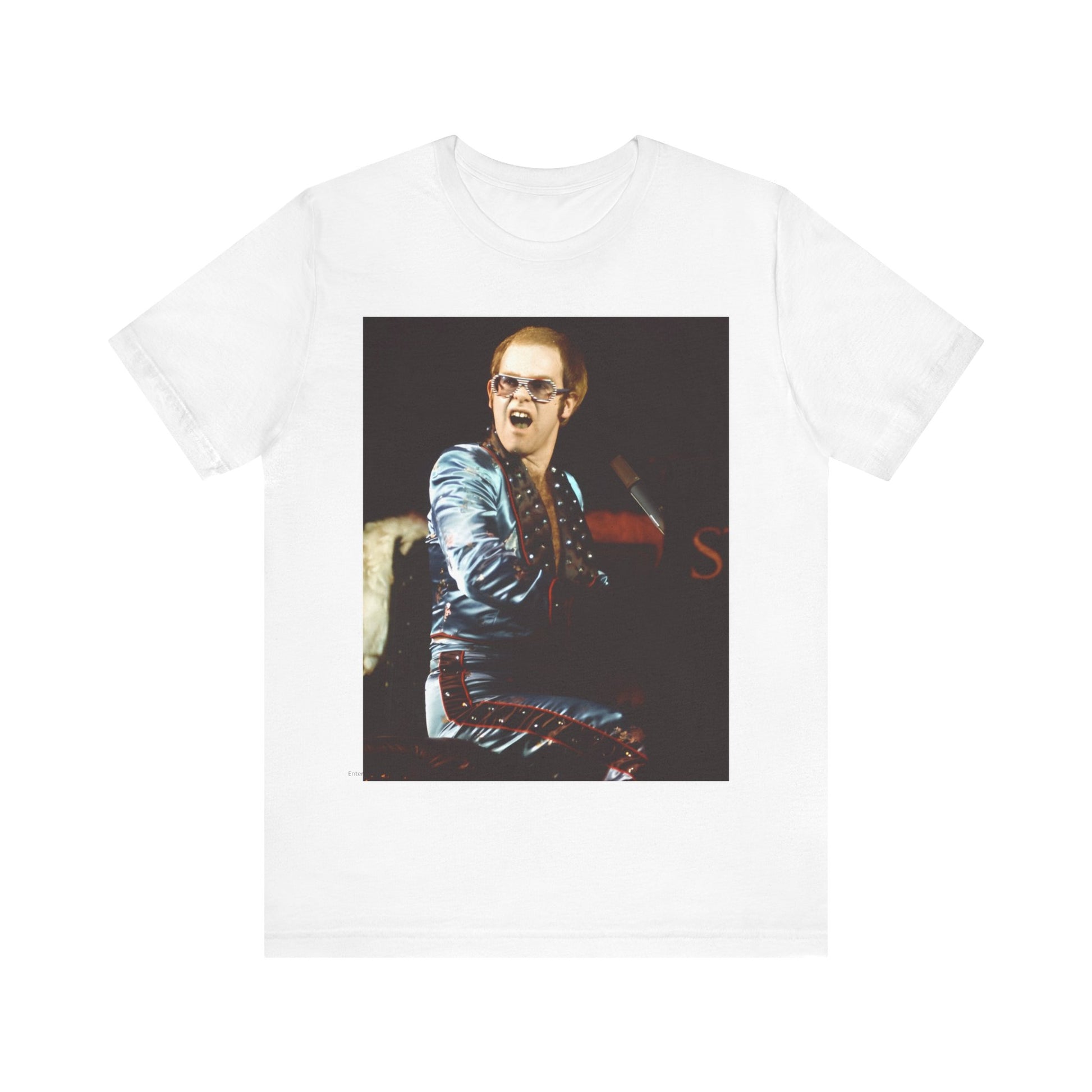 A black graphic t-shirt featuring a retro graphic related to Elton John's 'Rocket Man' song or era.