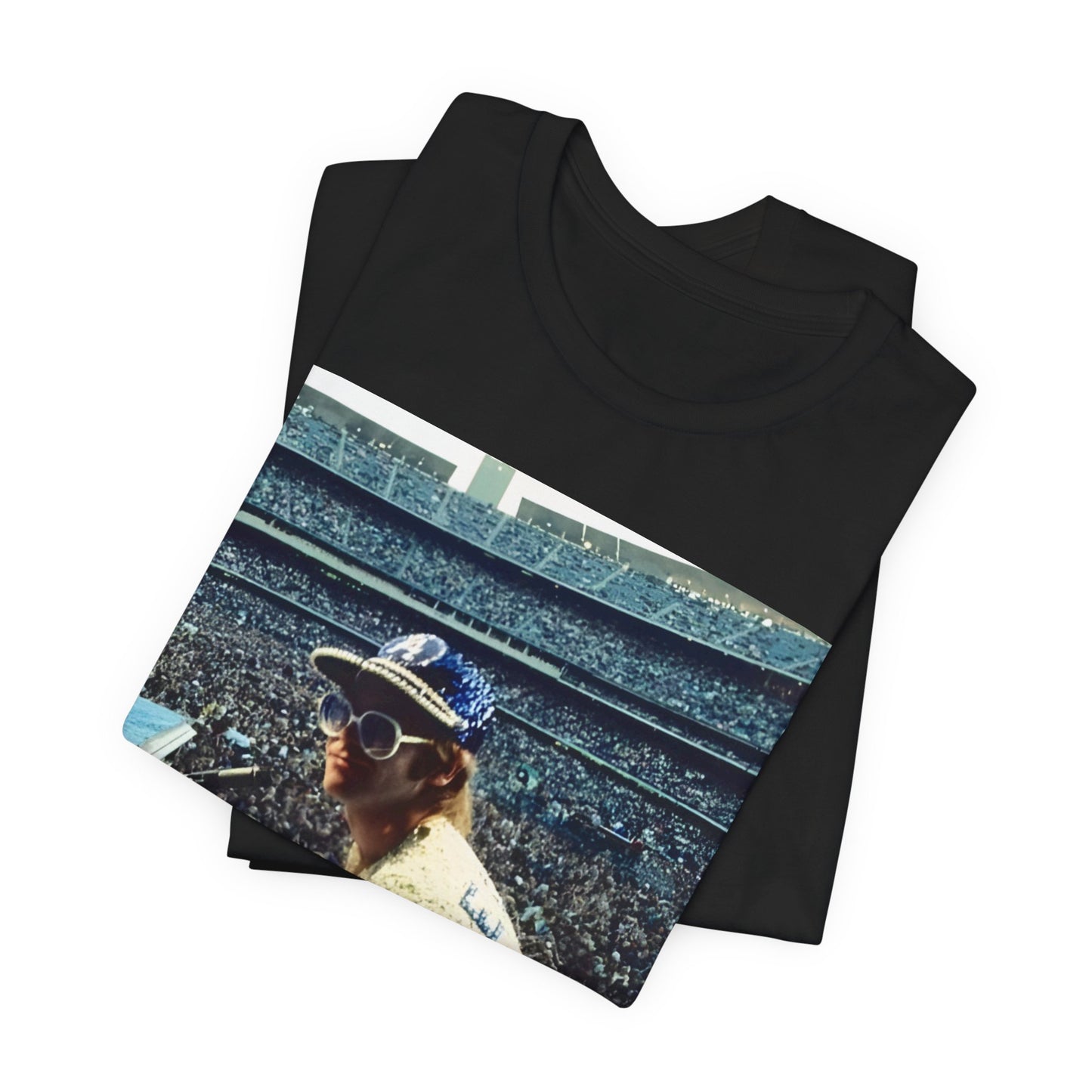 A black graphic t-shirt featuring a photo of Elton John from his 1975 Dodgers Stadium concert.