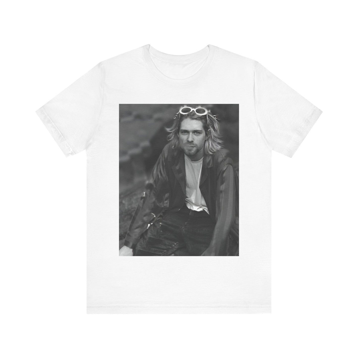A black graphic t-shirt featuring a 90s black and white photo portrait of Kurt Cobain from Nirvana.