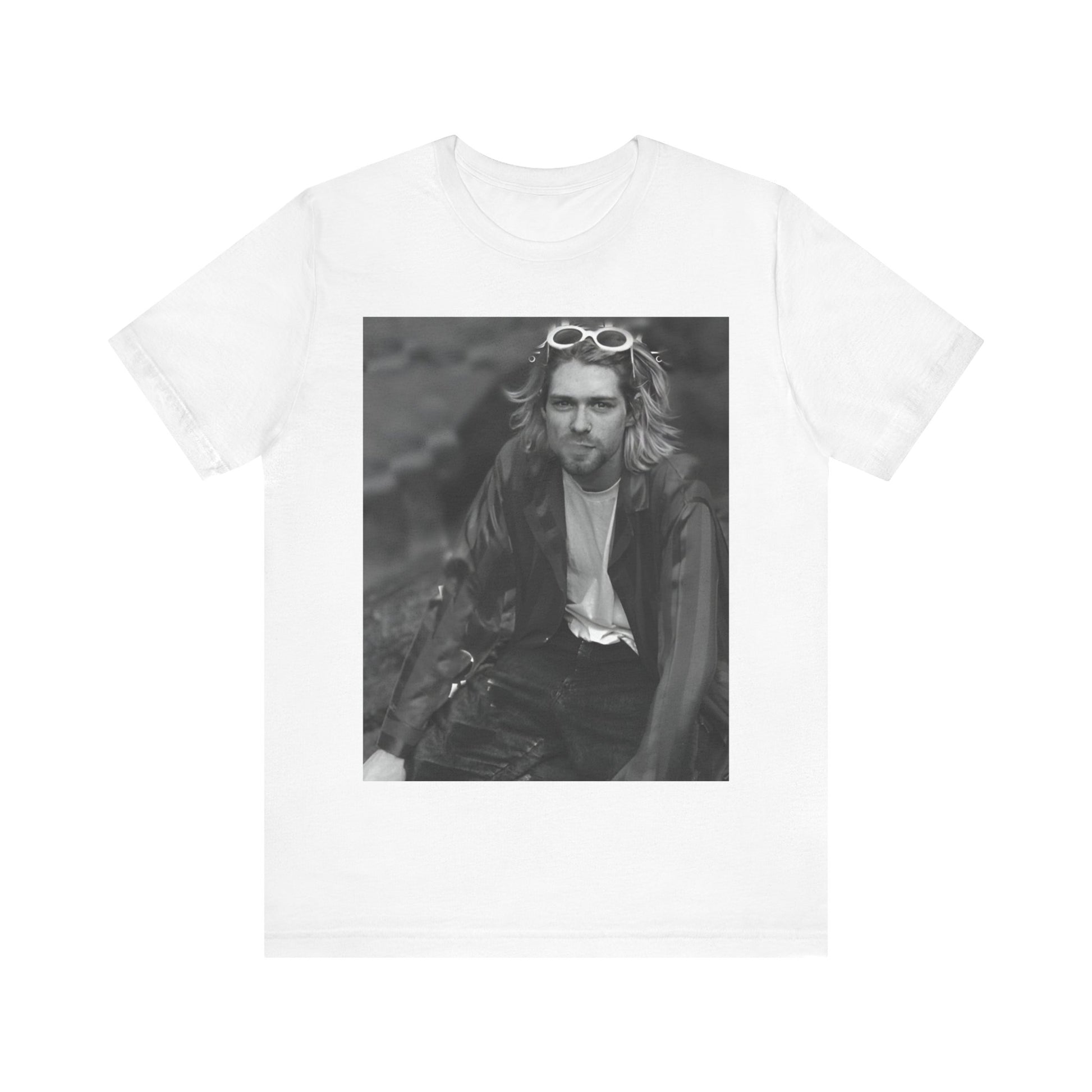 A black graphic t-shirt featuring a 90s black and white photo portrait of Kurt Cobain from Nirvana.