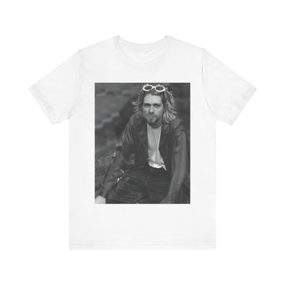 A black graphic t-shirt featuring a 90s black and white photo portrait of Kurt Cobain from Nirvana.