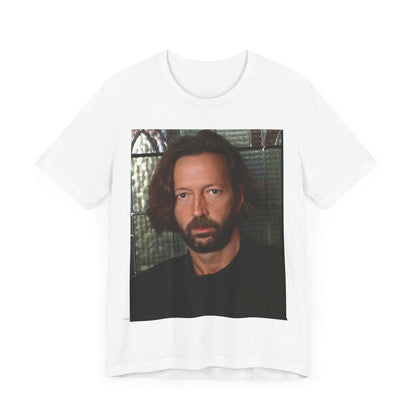 A black graphic t-shirt featuring a portrait graphic of Eric Clapton as a guitar god legend.