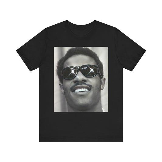 A black graphic t-shirt featuring a 70s funk aesthetic black and white graphic or photo of Stevie Wonder.