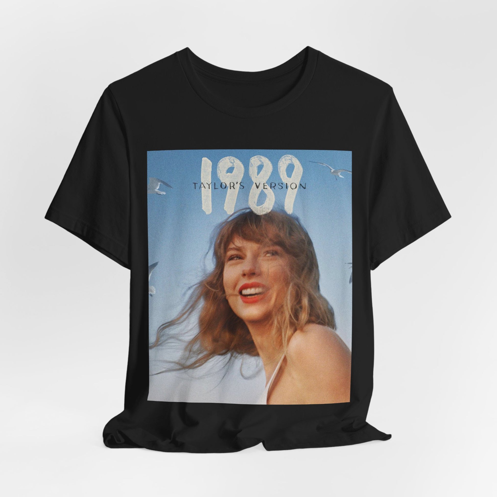 A black graphic t-shirt featuring a graphic related to Taylor Swift's 1989 album.