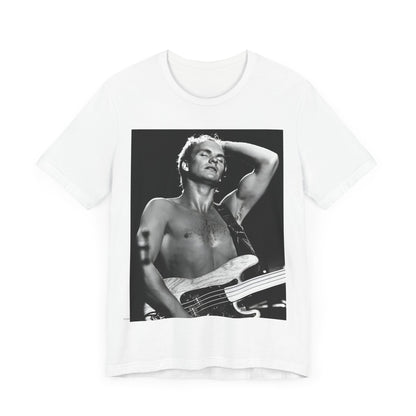 A black graphic t-shirt featuring a graphic or photo of Sting performing live on stage in 1983.