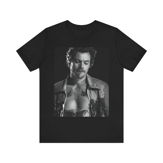 A black graphic t-shirt featuring a black and white graphic inspired by Harry Styles' tattoos.